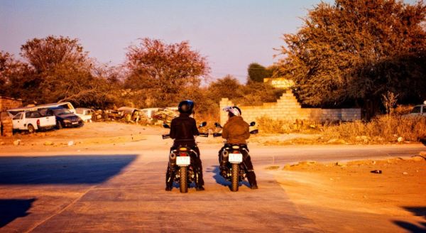 picture of two people on a motorcycle in Africa stopped at an intersection, taken by Steven Levitt.